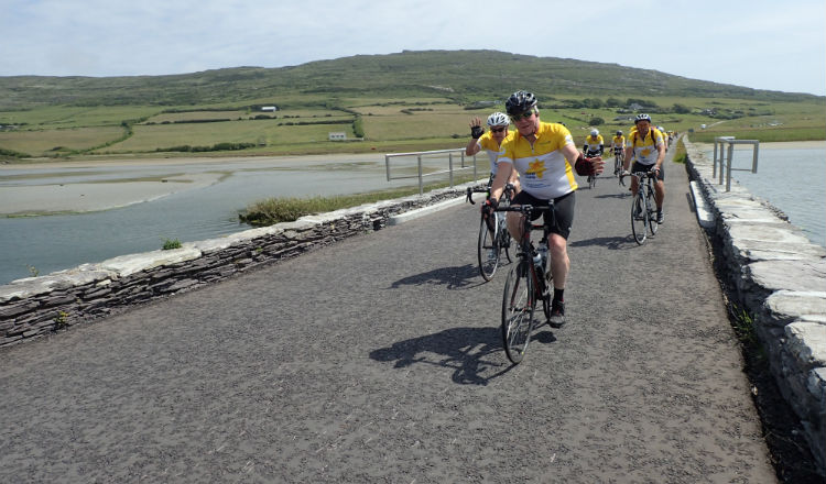 Cyclists crossing bridge