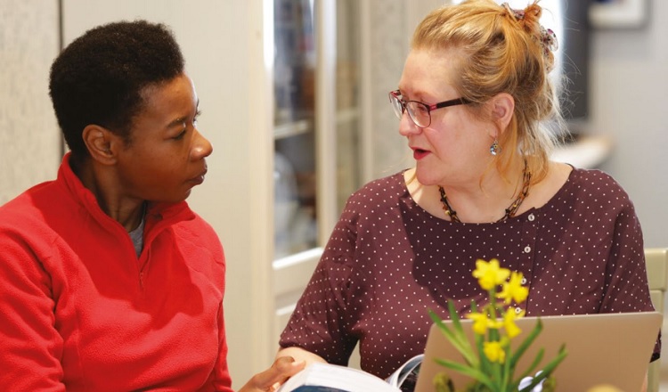 Two women talking about palliative care