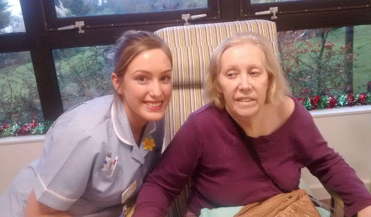 Marie Curie Nurse Faye Russell-Jones caring for one of her patients.