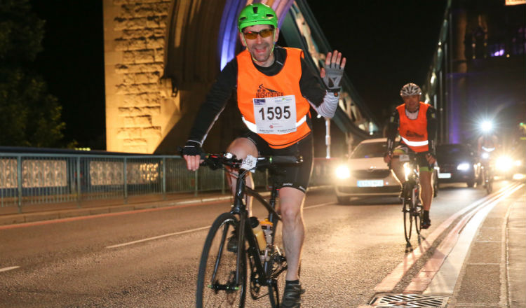 Man waving tower bridge Nightrider Marie Curie