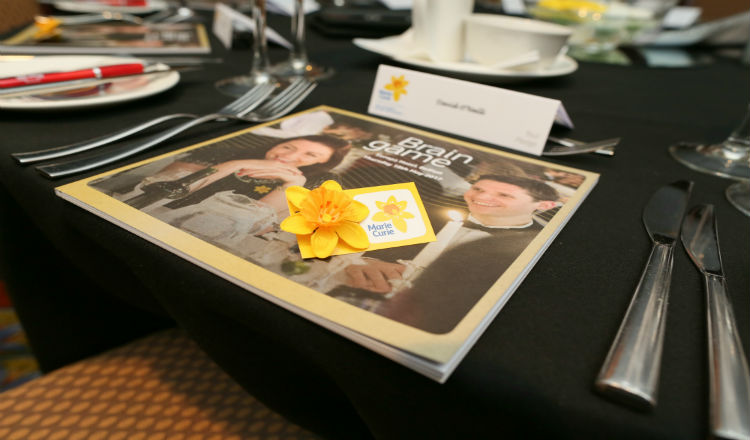 A copy of the Belfast Brain Game programme sits on a table