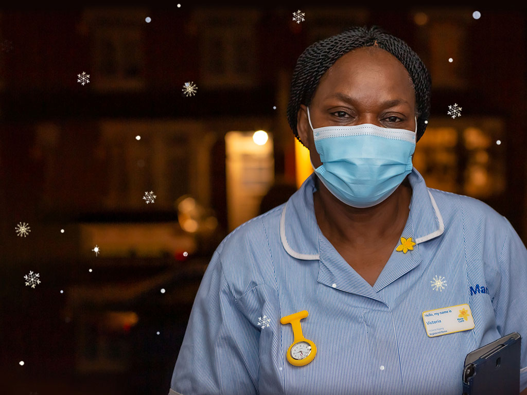 A Marie Curie Nurse wearing a face mask