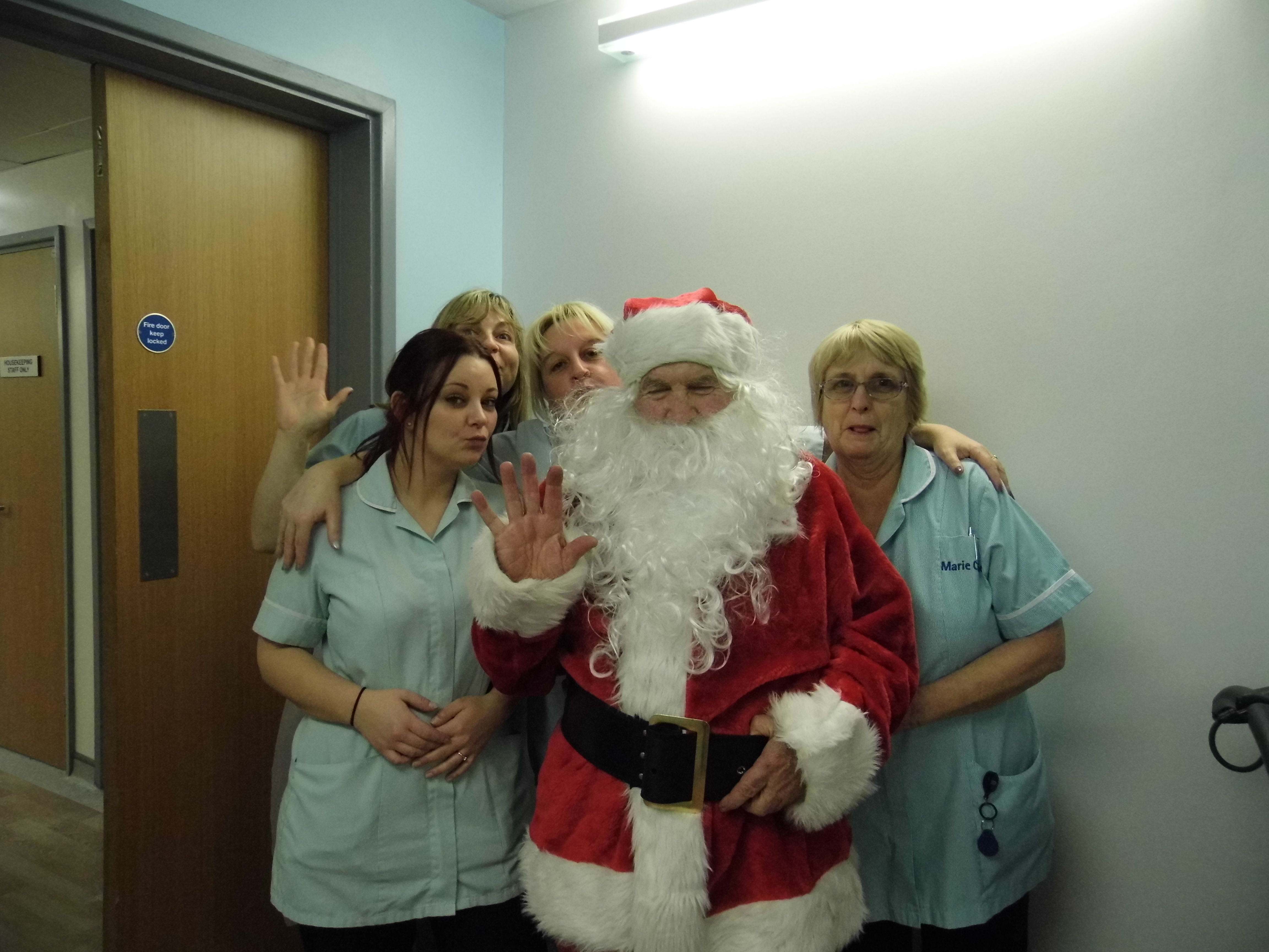 The hospice cleaning staff with Santa