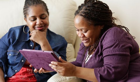 A Marie Curie Helper volunteer supporting a woman living with a terminal illness